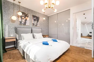 Łóżko lub łóżka w pokoju w obiekcie Apartament Moniuszki by Your Freedom