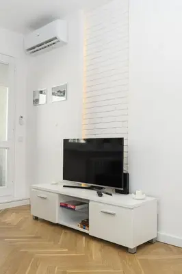 Telewizja i/lub zestaw kina domowego w obiekcie Old Town Grand Theatre Apartment 2