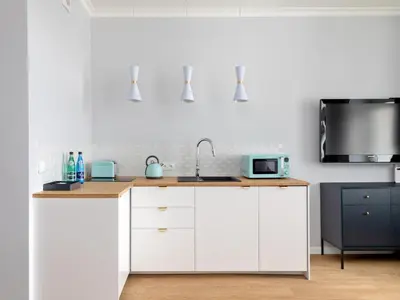 Kuchnia lub aneks kuchenny w obiekcie Premium Designed Apartment - Noakowskiego 16 by Noclegi Renters