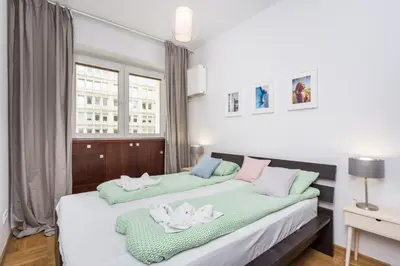 Łóżko lub łóżka w pokoju w obiekcie ShortStayPoland Krucza (B34)