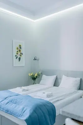 Łóżko lub łóżka w pokoju w obiekcie APARTEL Plac Unii Lubelskiej Studio