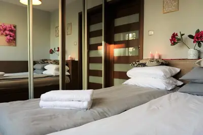 Łóżko lub łóżka w pokoju w obiekcie Stylish and spacious by Cooee Apartments