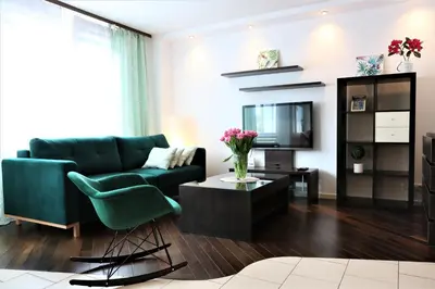 Telewizja i/lub zestaw kina domowego w obiekcie Stylish and spacious by Cooee Apartments