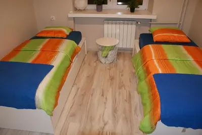 Łóżko lub łóżka w pokoju w obiekcie Apartament Grochowska Warszawa