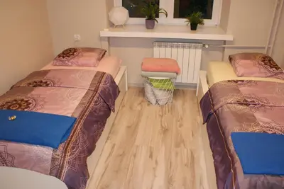 Łóżko lub łóżka w pokoju w obiekcie Apartament Grochowska Warszawa