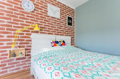 Łóżko lub łóżka w pokoju w obiekcie Apartament Twarda 54-Warszawski Sen