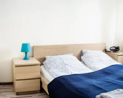 Łóżko lub łóżka w pokoju w obiekcie Marszałkowska Apartment