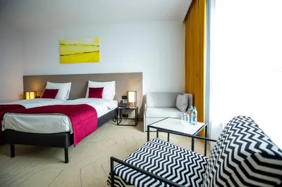 Łóżko lub łóżka w pokoju w obiekcie Arche Hotel Krakowska