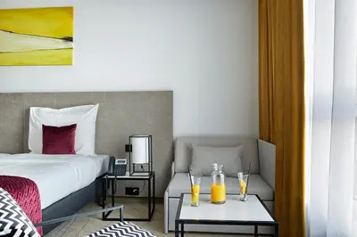 Łóżko lub łóżka w pokoju w obiekcie Arche Hotel Krakowska