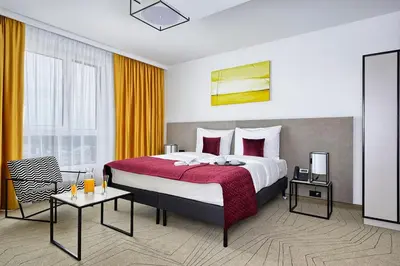 Łóżko lub łóżka w pokoju w obiekcie Arche Hotel Krakowska