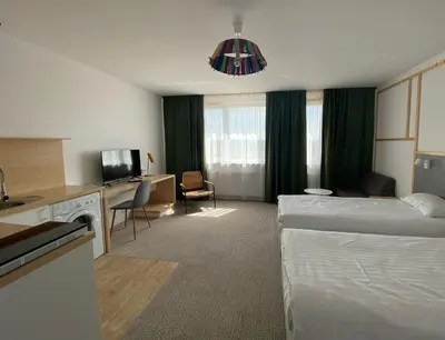 Łóżko lub łóżka w pokoju w obiekcie Arche Hotel Poloneza