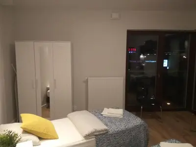 Łóżko lub łóżka w pokoju w obiekcie Klopot 4 Apartment
