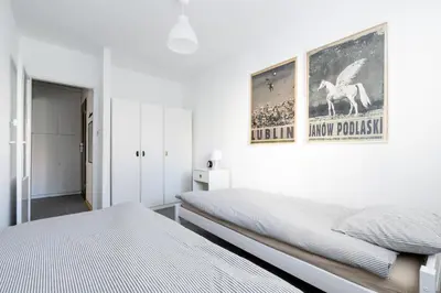 Łóżko lub łóżka w pokoju w obiekcie Chmielna Hammock Apartment
