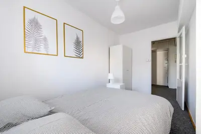 Łóżko lub łóżka w pokoju w obiekcie Chmielna Hammock Apartment