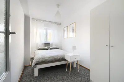 Łóżko lub łóżka w pokoju w obiekcie Chmielna Hammock Apartment