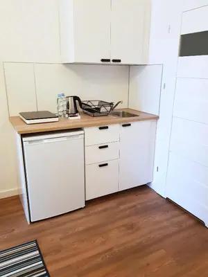 Kuchnia lub aneks kuchenny w obiekcie Apartamenty METRO Targówek