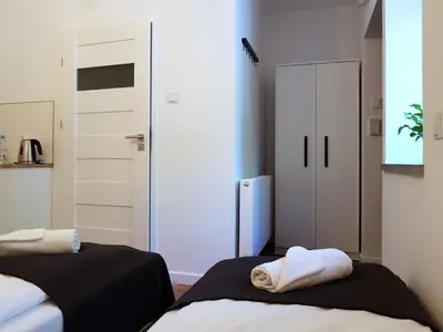 Łóżko lub łóżka w pokoju w obiekcie Apartamenty METRO Targówek