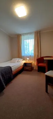 Łóżko lub łóżka w pokoju w obiekcie Astral