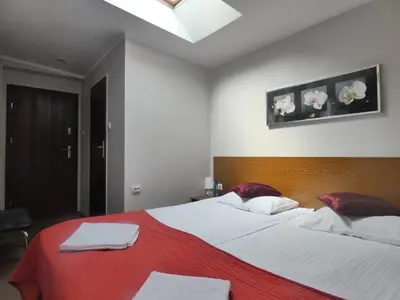 Łóżko lub łóżka w pokoju w obiekcie Astral