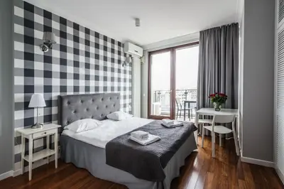 Łóżko lub łóżka w pokoju w obiekcie Triton Park Apartments