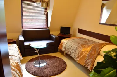 Łóżko lub łóżka w pokoju w obiekcie Camping Motel WOK