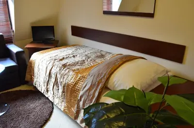 Łóżko lub łóżka w pokoju w obiekcie Camping Motel WOK