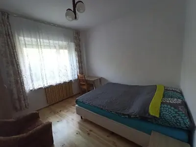 Łóżko lub łóżka w pokoju w obiekcie Pokój w Warszawie-Wawer