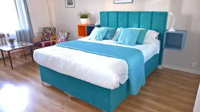 Łóżko lub łóżka w pokoju w obiekcie Comfort In Warsaw Apartment