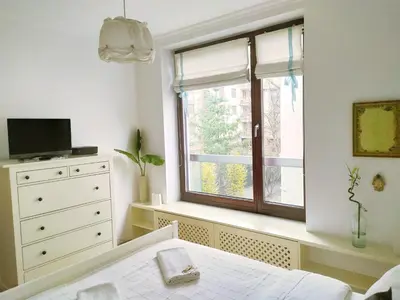 Łóżko lub łóżka w pokoju w obiekcie Warsaw Concierge Vistula Apartment