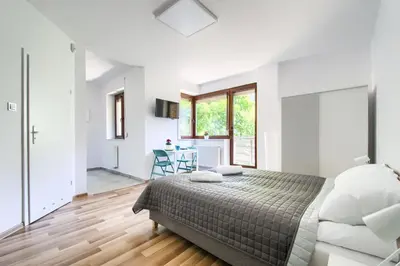 Łóżko lub łóżka w pokoju w obiekcie Art Apartments