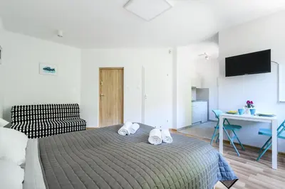 Łóżko lub łóżka w pokoju w obiekcie Art Apartments