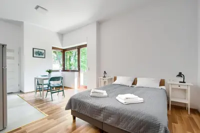 Łóżko lub łóżka w pokoju w obiekcie Art Apartments