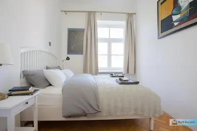 Łóżko lub łóżka w pokoju w obiekcie Warsaw Concierge Praga Gallery
