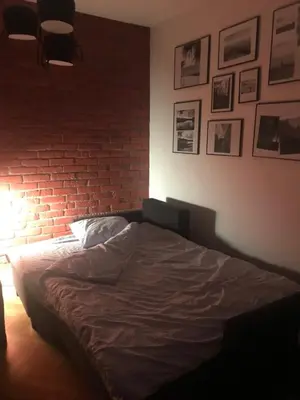 Łóżko lub łóżka w pokoju w obiekcie Warszawa Hoża