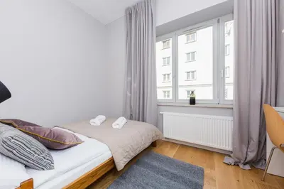 Łóżko lub łóżka w pokoju w obiekcie ShortStayPoland Środkowa