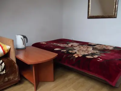 Łóżko lub łóżka w pokoju w obiekcie Dworek w Zieleni
