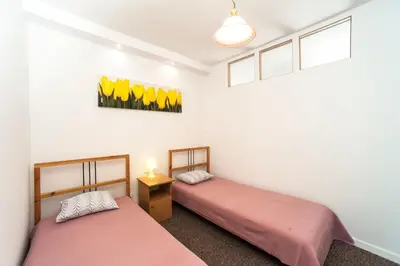 Łóżko lub łóżka w pokoju w obiekcie Apartamenty Dobranoc - Wawer