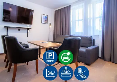 Telewizja i/lub zestaw kina domowego w obiekcie Warsaw Apartments - Apartamenty Sadyba