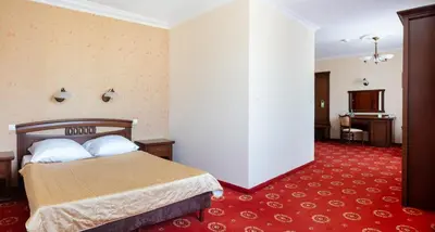 Łóżko lub łóżka w pokoju w obiekcie Hotel Arkadia Royal