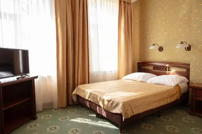 Łóżko lub łóżka w pokoju w obiekcie Hotel Arkadia Royal