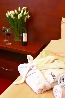 Łóżko lub łóżka w pokoju w obiekcie Hotel Amber