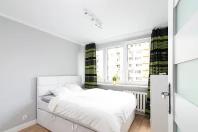 Łóżko lub łóżka w pokoju w obiekcie Pańska Residence