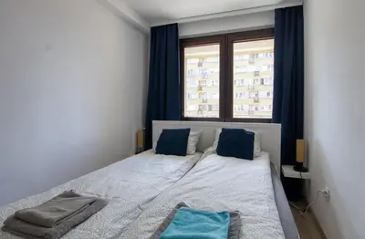 Łóżko lub łóżka w pokoju w obiekcie Pańska Residence