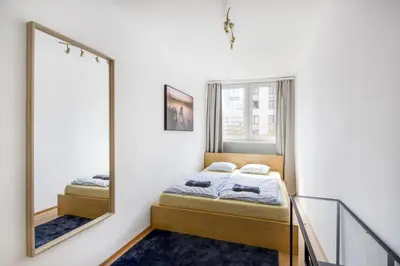 Łóżko lub łóżka w pokoju w obiekcie Pańska Residence