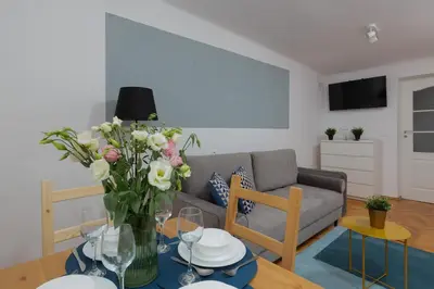 Telewizja i/lub zestaw kina domowego w obiekcie Stars Apartament City Center by Noclegi Renters