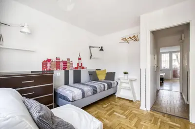 Łóżko lub łóżka w pokoju w obiekcie Labo Apartment Metro Plocka