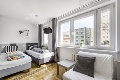 Łóżko lub łóżka w pokoju w obiekcie Labo Apartment Metro Plocka