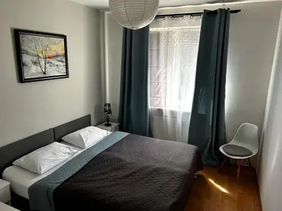 Łóżko lub łóżka w pokoju w obiekcie Kasztanowa Apartament