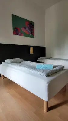 Łóżko lub łóżka w pokoju w obiekcie Central Station Hostel