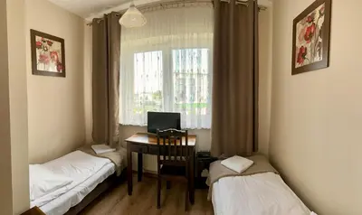 Łóżko lub łóżka w pokoju w obiekcie Hotelik Korona